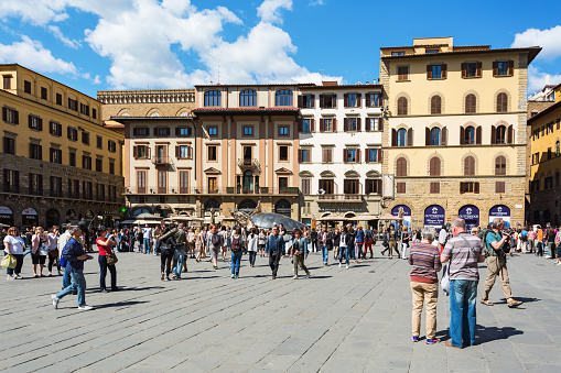 Florence, Italy - April 19, 2016: People on the Piazza della Signoria in Florence