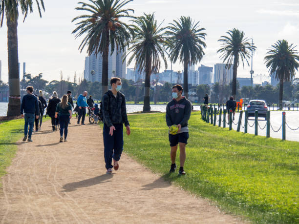 People out exercising and socialising during Melbourne coronavirus lockdown stock photo