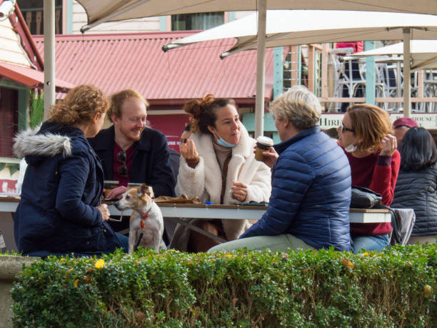 People outdoor dining wearing masks in Melbourne stock photo