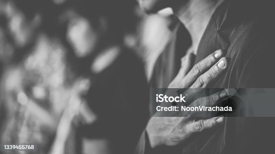 istock People praying together at Church. 1339455768