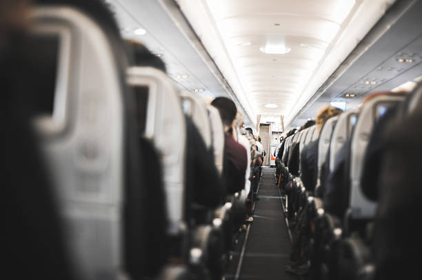 People sitting in the airplane stock photo