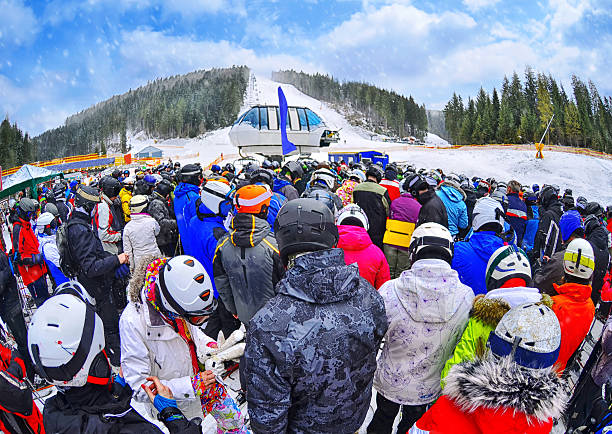 people stand before ski lift in queue in bukovel - skidled bildbanksfoton och bilder
