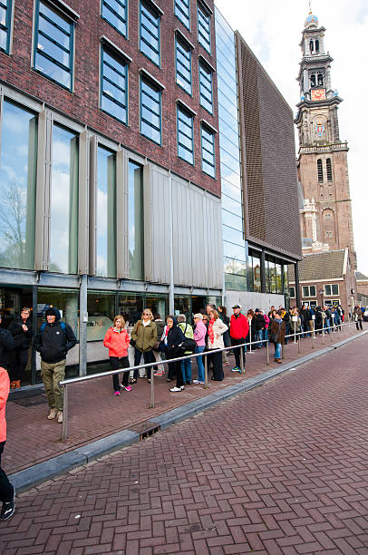 people  stand to visit the anne frank house museum. - anne frank stockfoto's en -beelden