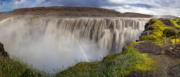 People standing at the Dettifoss XXL Panorama The Majestic Dettifoss Waterfalls in Iceland dettifoss waterfall stock pictures, royalty-free photos & images