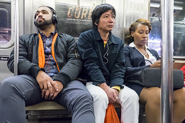 people traveling in a subway train in new york city - subway snapshot stockfoto's en -beelden