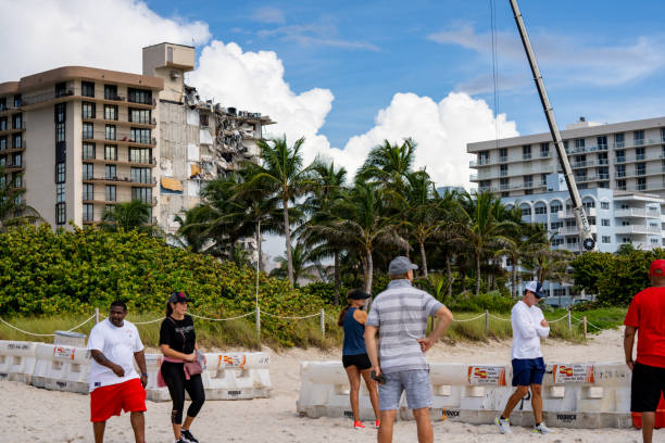 People visiting the site of the collapsed Chaplain Towers Surfside in Miami stock photo