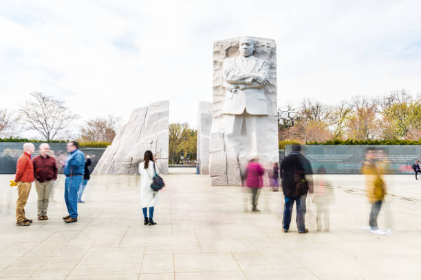People walking at Martin Luther King Jr Memorial during Cherry Blossom Festival Washington Dc: People walking at Martin Luther King Jr Memorial during Cherry Blossom Festival mlk memorial stock pictures, royalty-free photos & images