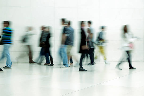 People walking in corridor, blurred motion  long exposure stock pictures, royalty-free photos & images