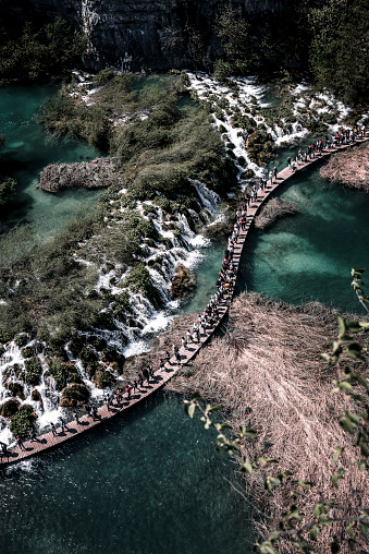 People Walking In Line On Plitvice Lakes, Croatia