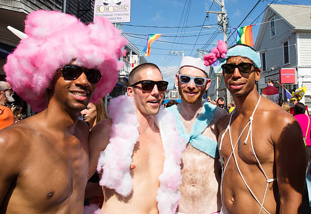 People walking in the 37th Annual Provincetown Carnival Parade in Provincetown, Massachusetts. stock photo