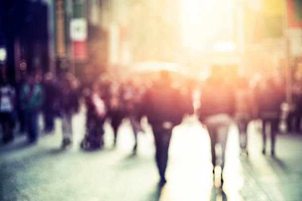 people walking in the street, blurry - street motion blur stockfoto's en -beelden