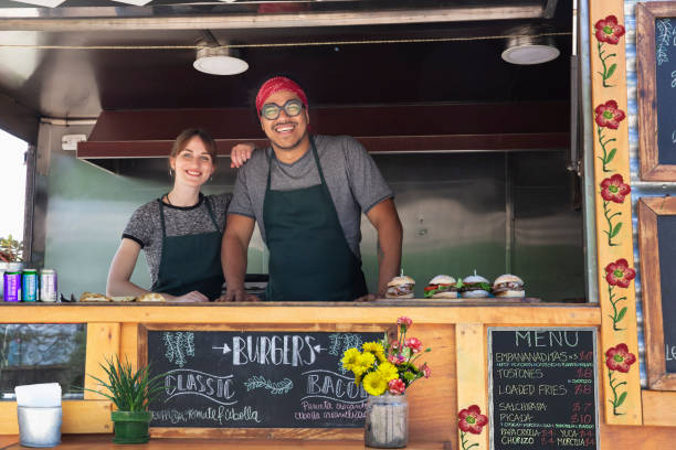 people working in food truck stock photo