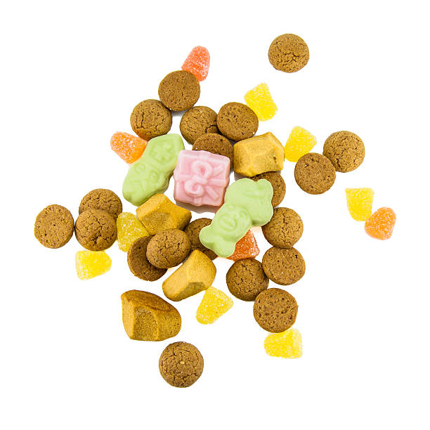 pepernoten and sweets isolated on white - pepernoten stockfoto's en -beelden