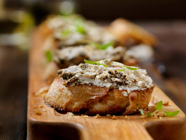 Peppered Goat Cheese Crostini with Micro Basil Peppered Goat Cheese Crostini with Micro Basil crostini photos stock pictures, royalty-free photos & images