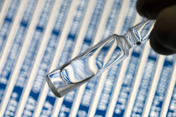 peptide medicine in the glass vial with peptide sequence background stock photo