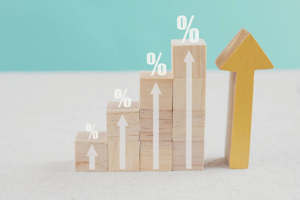 percentages and arrows up on wooden blocks ladder, growth and success business concept stock photo
