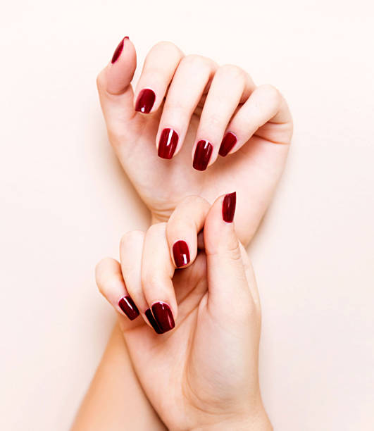 Perfect red nails Beautiful nails painted in red nail salon stock pictures, royalty-free photos & images