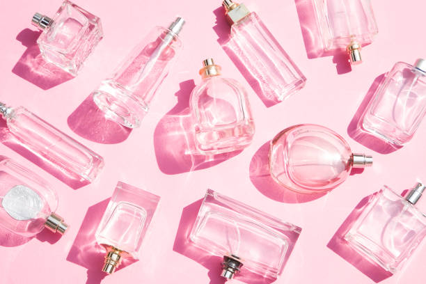 Perfume bottles Perfume bottles on pink background scented stock pictures, royalty-free photos & images