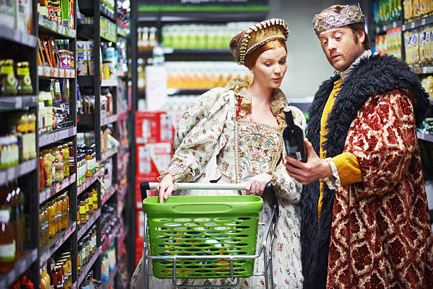 Perhaps the lady prefers this blend? A king and queen selecting wine in the supermarket period costume stock pictures, royalty-free photos & images