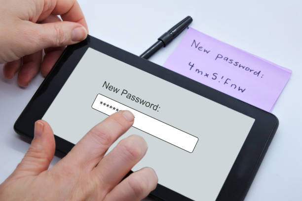Person changing new password on a tablet portable device stock photo