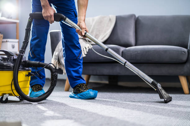Person Cleaning Carpet With Vacuum Cleaner Photo Of Janitor Cleaning Carpet With Vacuum Cleaner cleaning stock pictures, royalty-free photos & images