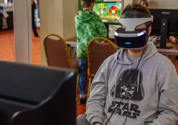 Person using Playstation VR headset stock photo