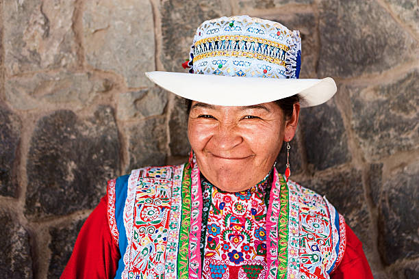 Peruvian woman in national clothing, Chivay, Peru Chivay is a town in the Colca valley, capital of the Caylloma province in the Arequipa region, Peru. Located at about 12,000  ft above sea level, it lies upstream of the renowned Colca Canyon. It has a central town square and an active market. Ten  kilometers to the east, and 1,500 meters above the town of Chivay lies the Chivay obsidian source. Thermal springs are  located 3 km from town, a number of heated pools have been constructed. A stone "Inca" bridge crosses the Colca River ravine,  just to the north of the town. The town is a popular staging point for tourists visiting Condor Cross or Cruz Del Condor,  where condors can be seen catching thermal uplifts a few kilometers downstream.http://bem.2be.pl/IS/peru_380.jpg peru woman stock pictures, royalty-free photos & images