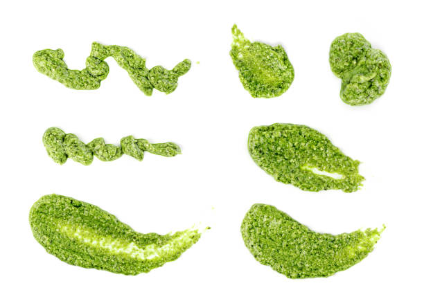 Pesto sauce spread or blob isolated on white background stock photo