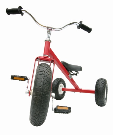 A child's red all-terrain tricycle.All images in this series...