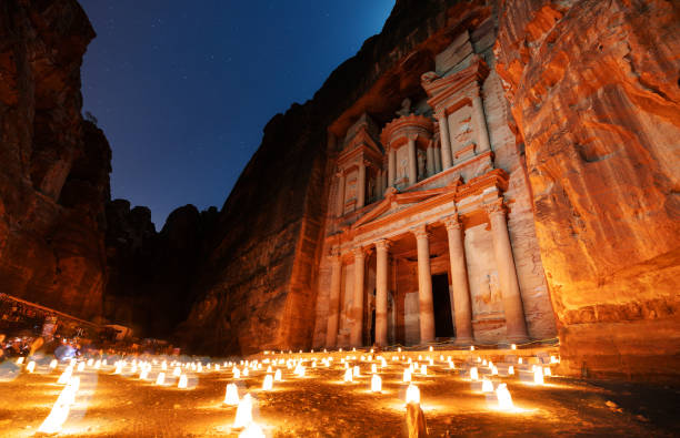 Petra by night, ancient architecture in canyon, Petra in Jordan. The rose city at night, famous travel destination in Middle-East, Jordan Petra by night, ancient architecture in canyon, Petra in Jordan. The rose city at night, famous travel destination in Middle-East, Jordan jordan middle east stock pictures, royalty-free photos & images