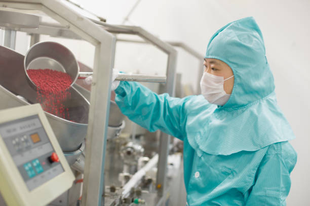 Pharmaceutical factory worker stock photo