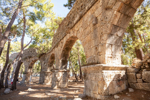 Phaselis Ancient City in Kemer of Antalya. Glorious beaches, calm sea, fab snorkelling and all set within ancient ruins that set the imagination. Very nice and historical place very quiet beach. stock photo