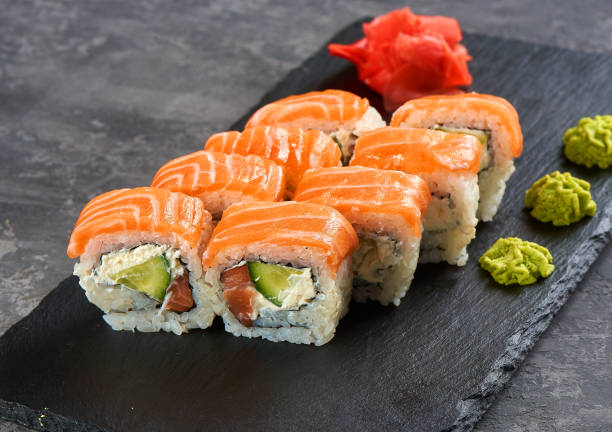 Philadelphia roll sushi with salmon, prawn, avocado, cream cheese. Sushi menu. Japanese food. stock photo
