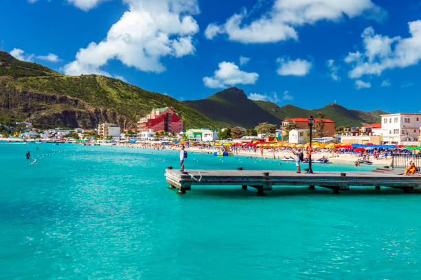Phillipsburg beach in Dutch St Martin where there's resort hotels, beaches, boats and mountain scenery ready to enjoy stock photo