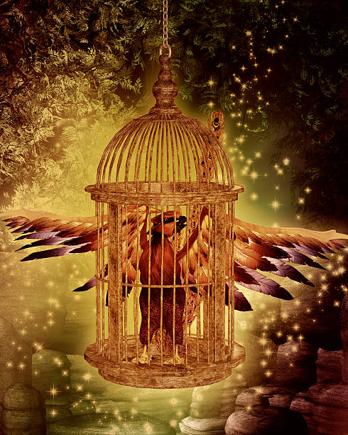 Phoenix in cage rising from the ashes stock photo