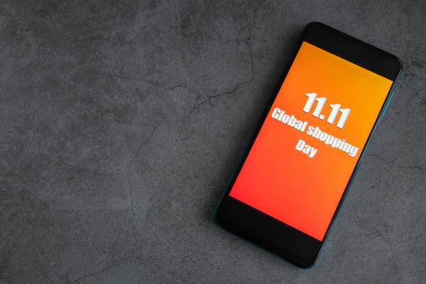 Phone with the image of 11.11 global shopping day stock photo