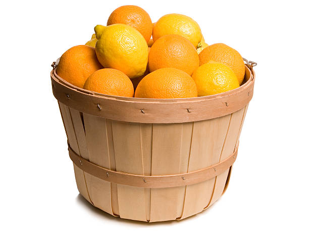 Photo bushel basket overflowing with lemons stock photo