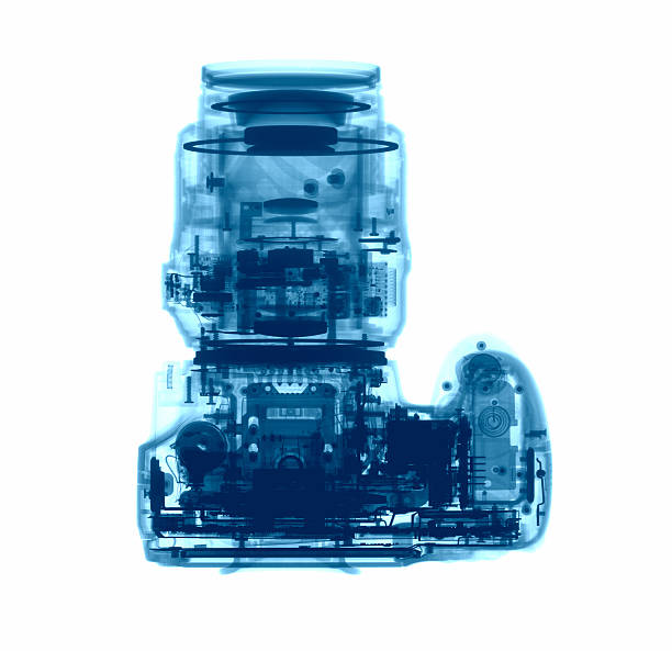 DSLR photo camera under the X-rays DSLR photo camera under the X-rays in blue tones x ray image photos stock pictures, royalty-free photos & images