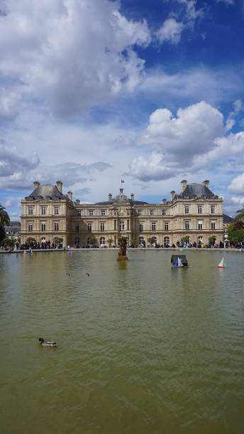Photo from famous Luxembourg gardens and Palace on a spring moring with beautiful scattered clouds, Paris, France stock photo
