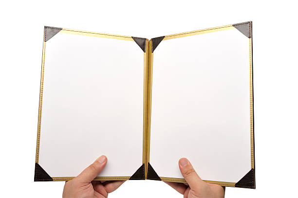 A photo of a menu opened to a empty pages stock photo