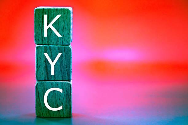 photo on know your customer (KYC) guidelines in financial services theme. wooden cubes with the abbreviation "KYC", against the background like the northern lights stock photo