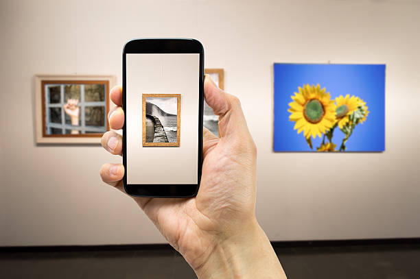 photograph a painting man photograph a painting at an exhibition of the museum.Background photos are my property exhibition photos stock pictures, royalty-free photos & images