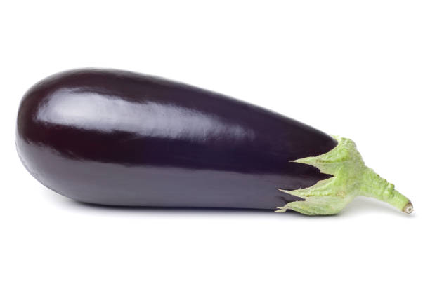 Photograph of fresh single eggplant on a white background stock photo