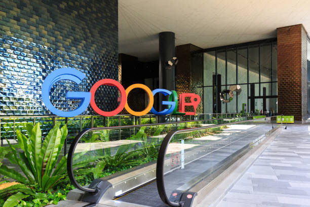 a photograph of the google logo in the lobby of google's new campus and office in singapore - google imagens e fotografias de stock