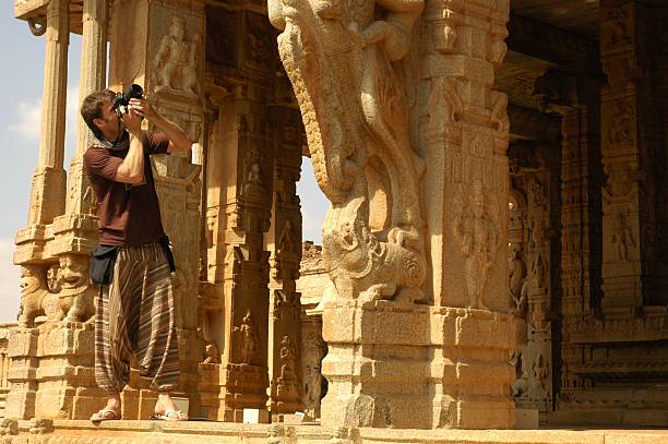 Photographer on the temple Taking photographs inside a temple hampi stock pictures, royalty-free photos & images