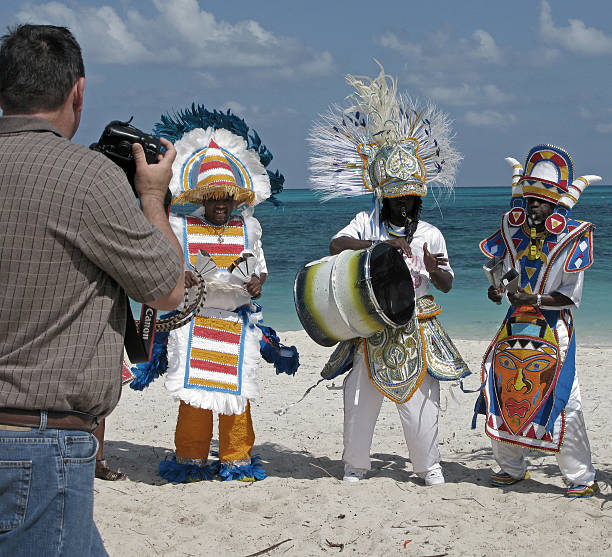 Photographing Performing Junkanoos on the Beach stock photo