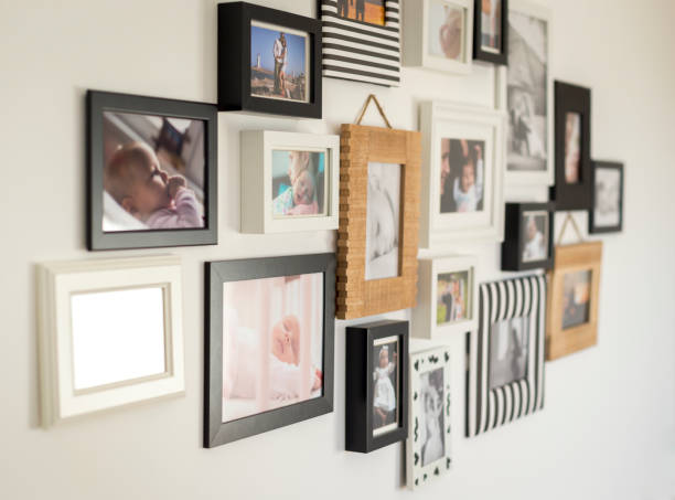 photos of the family in various photo frames white wall with photos of the family in various photo frames slovakia photos stock pictures, royalty-free photos & images