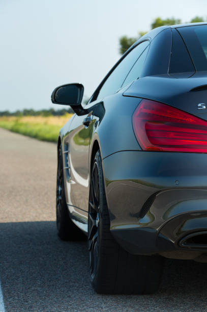 Photos of the Mercedes Benz SL550 convertible on the road. stock photo