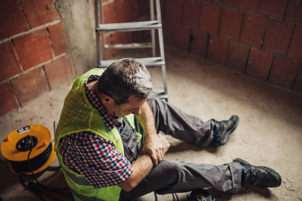 Physical injury at work of construction worker  physical injury stock pictures, royalty-free photos & images