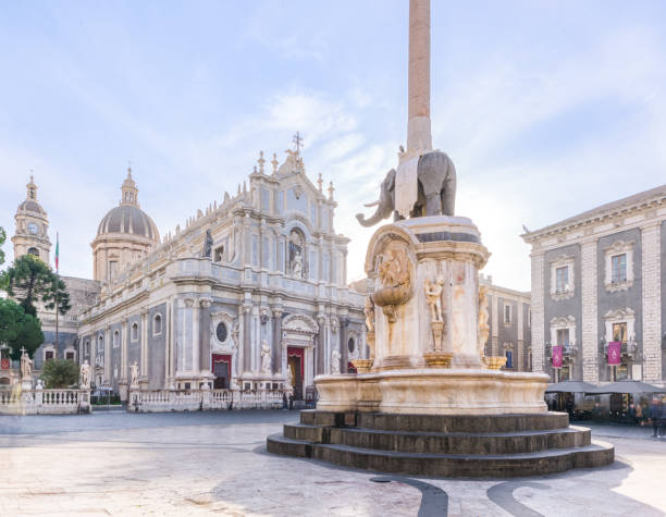 Piazza Duomo and Elephant fountain in Catania, Italy Saint Agatha cathedral church and the Liotru elephant fountain around a medieval town square at sunrise,  a famous Baroque style landmark in Catania, Sicily, Italy cupola stock pictures, royalty-free photos & images